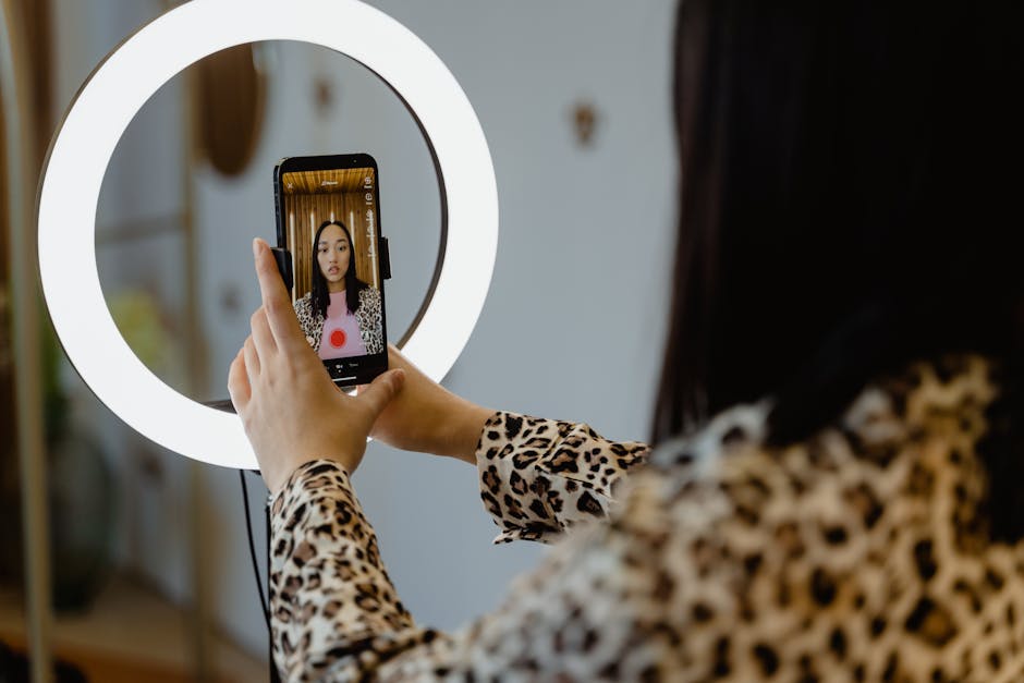 An Instagram influencer creating content with a smartphone and ring light