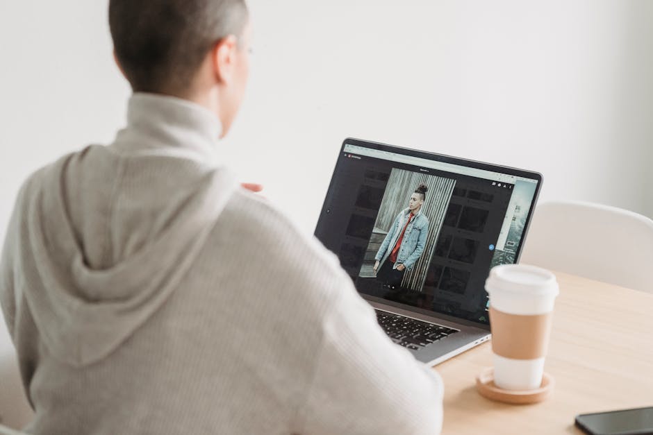 A photographer editing and uploading images to an online marketplace