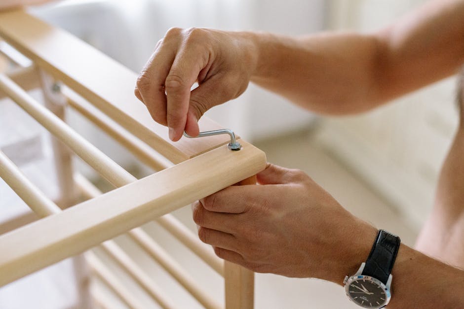 A TaskRabbit worker assembling furniture in a client's home