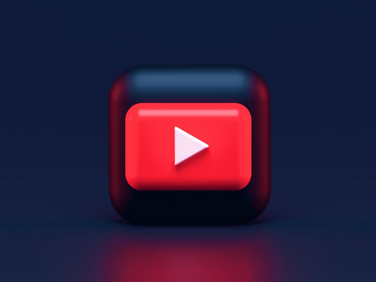 Strategies to increase YouTube channel visibility - illustration of a YouTuber reaching out to different social media platforms for promotion